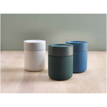 Load image into Gallery viewer, Java 330 ml ceramic tumbler with silicone wrap and plastic lid — lifestyle