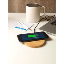 Load image into Gallery viewer, Essence 15W bamboo wireless charging pad — lifestyle