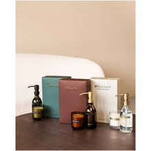 Load image into Gallery viewer, Wellmark Discovery 250 ml hand soap dispenser and 150 g scented candle set — lifestyle