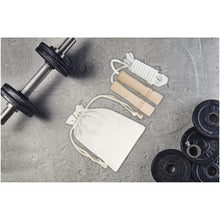 Load image into Gallery viewer, Denise wooden skipping rope in cotton pouch — lifestyle