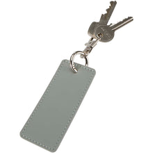 Load image into Gallery viewer, Resi Plus GRS recycled rectangle charm keychain — Grey (detail)