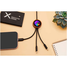 Load image into Gallery viewer, SCX.design C37 40W 5-in-1 rPET light-up logo charging cable with round wooden casing — lifestyle